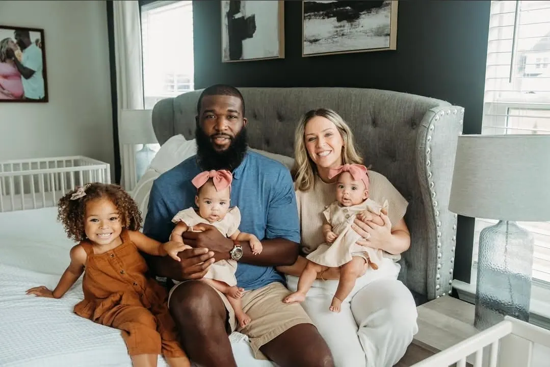 The owner and family at home: two adults, a toddler and two babies